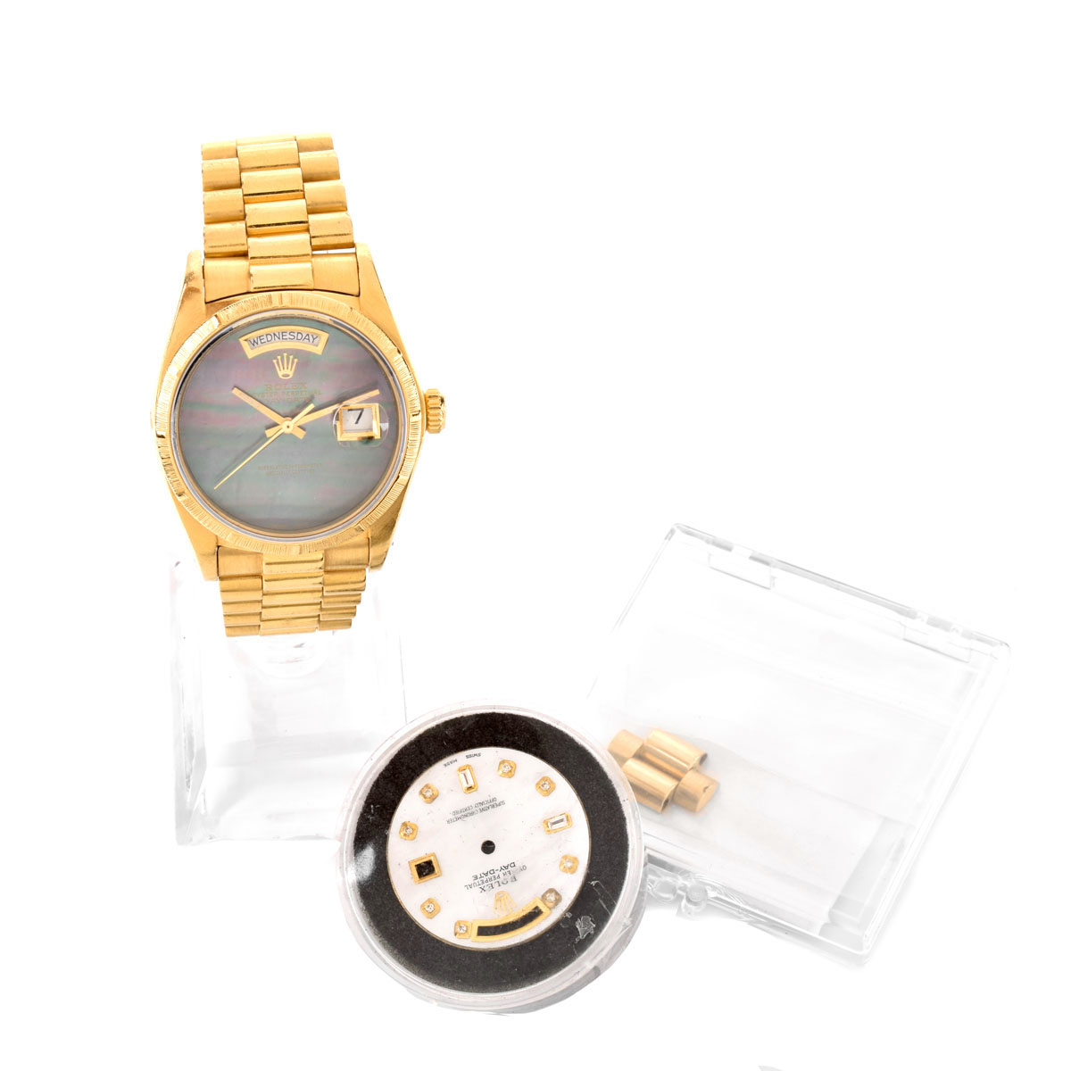 Man's Rolex 18 Karat Yellow Gold President Day-Date Bracelet Watch with Black Mother of Pearl Dial and Original White Mother of Pearl Dial with Diamond Hour Markers, Extra Bracelet Links. Case measures 36mm.