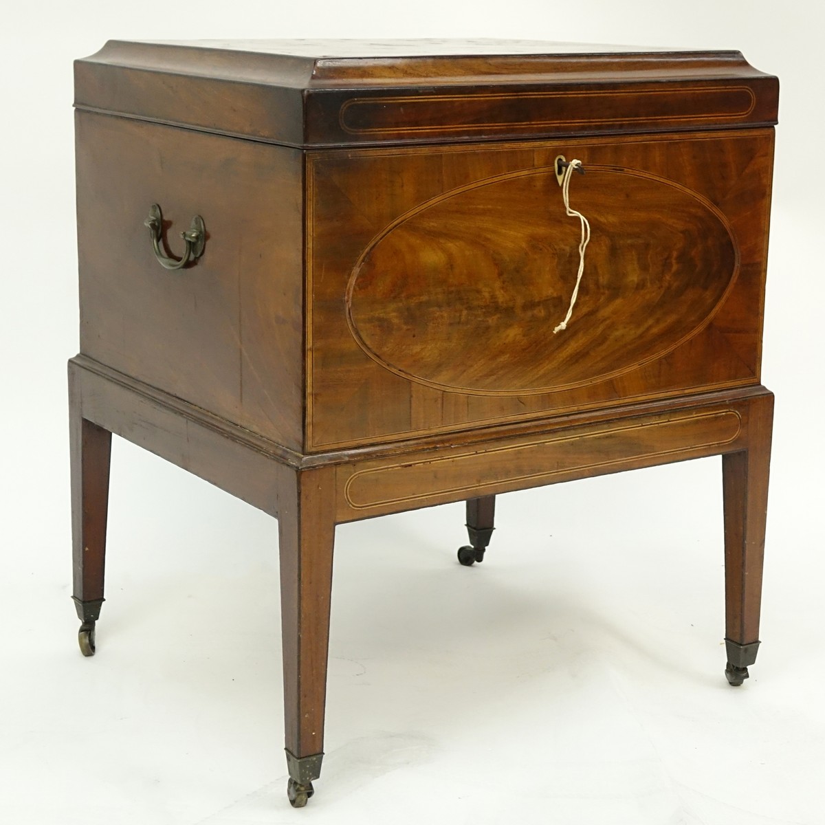 English George III Flame Mahogany Inlaid Cellarette on Casters. Lined interior, stands on squared tapering legs, key included.