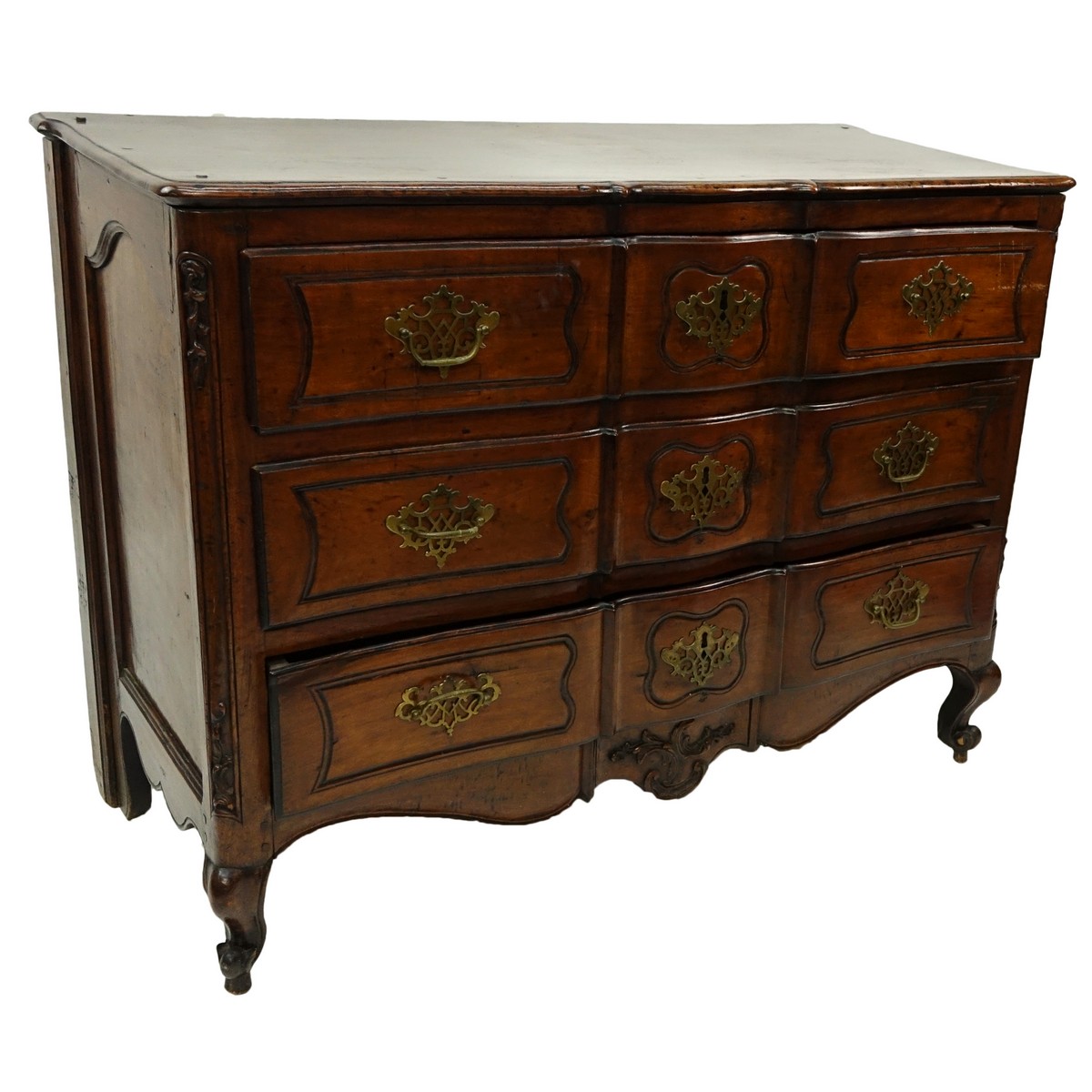 19th Century French Carved Walnut Commode/Chest of Drawers with Bronze Pulls. Three large fitted drawers and stands on front cabriole and rear bracket legs.