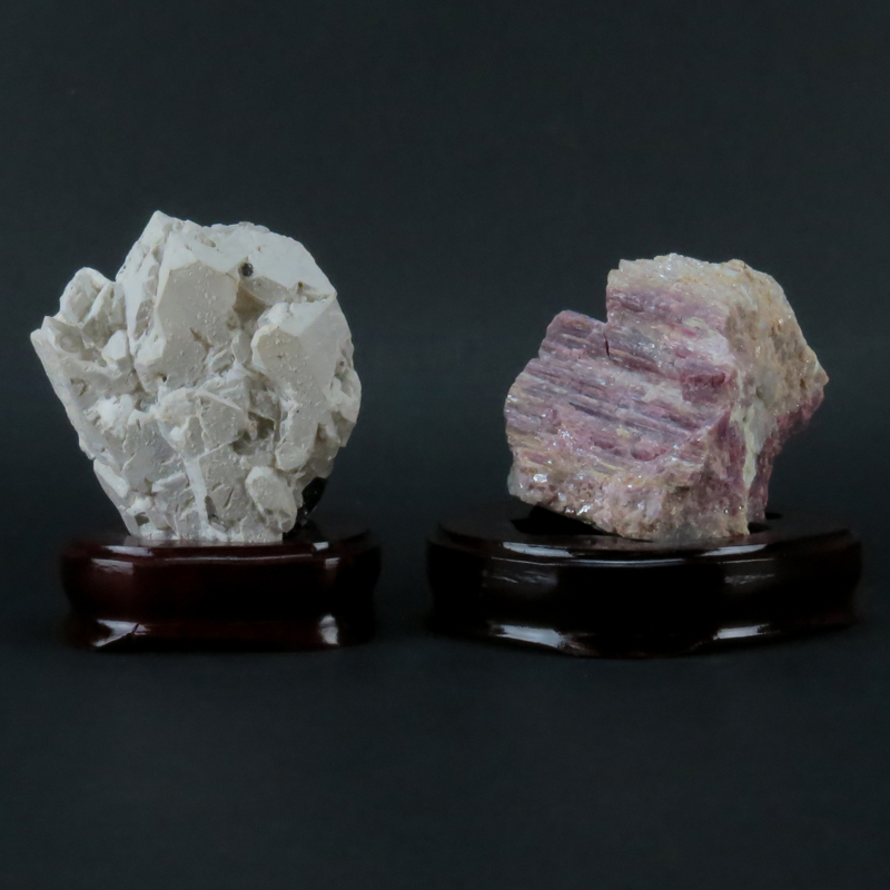 Two (2) Agate Mineral Specimens on Wooden Stands. Both are unpolished with various shades.