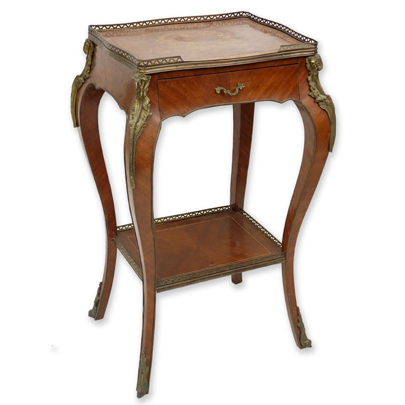 20th Century Louis XV Style Bronze Mounted Marquetry Inlaid Side Table with Drawer. Floral marquetry inlaid top with gallery, lower shelf stretcher also with gallery, and goat figural mountings along each leg.