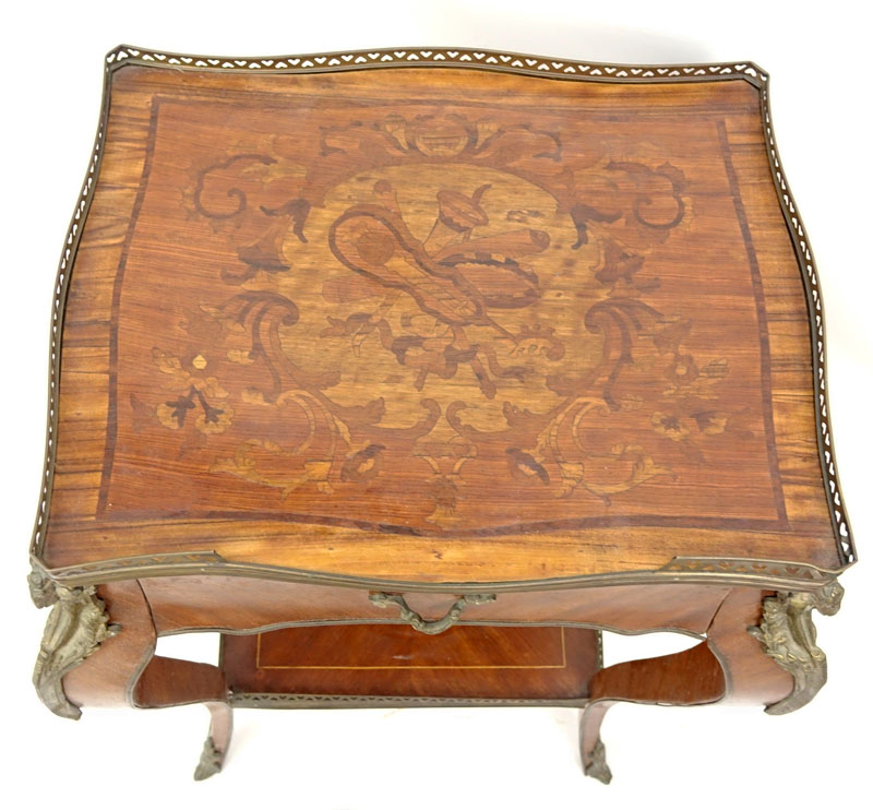 20th Century Louis XV Style Bronze Mounted Marquetry Inlaid Side Table with Drawer. Floral marquetry inlaid top with gallery, lower shelf stretcher also with gallery, and goat figural mountings along each leg.