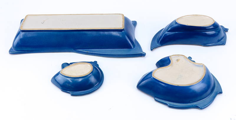 Four Pieces Roseville Blue Pine Cone Pottery Table Wares. Includes various shaped serving dishes.