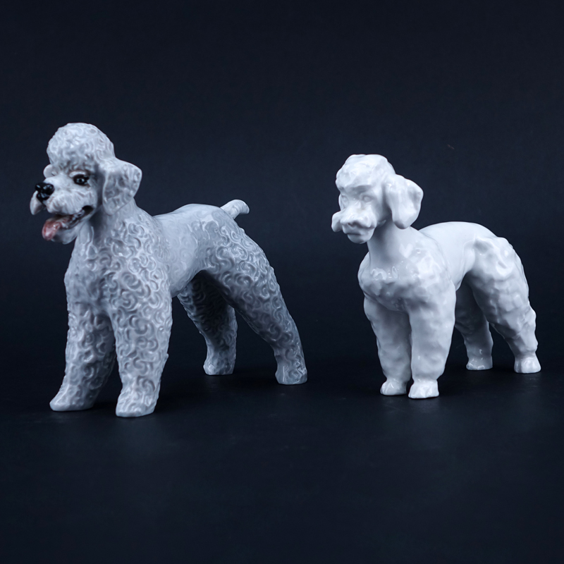 Two Porcelain Poodle Figurines. One signed with Meissen mark, one with Rosenthal mark.