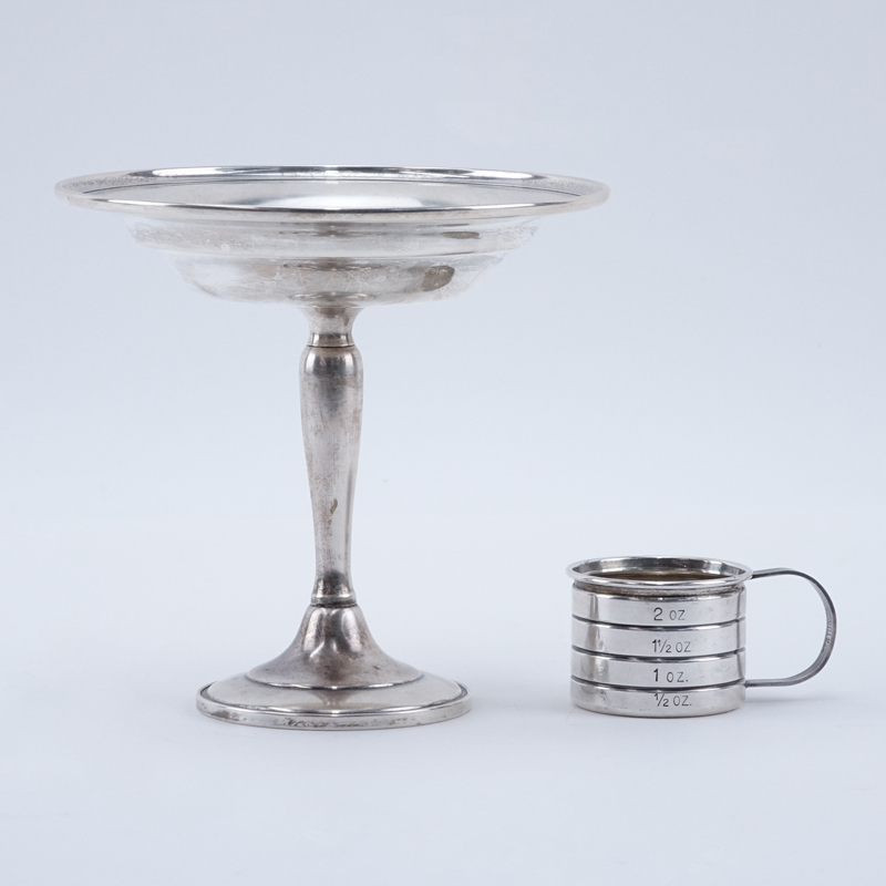 Lot of Two (2) Sterling Silver Tableware. Includes: weighed sterling silver compote and 2 oz measuring cup.