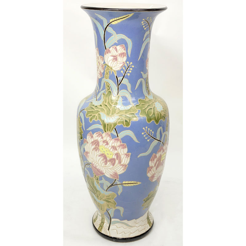 Monumental Majolica Pottery Vase. Features Asian inspired lotus flower motif on blue ground.