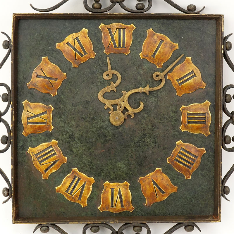 Vintage Wrought Iron Wall Clock. Roman numeral display with decorative hands.