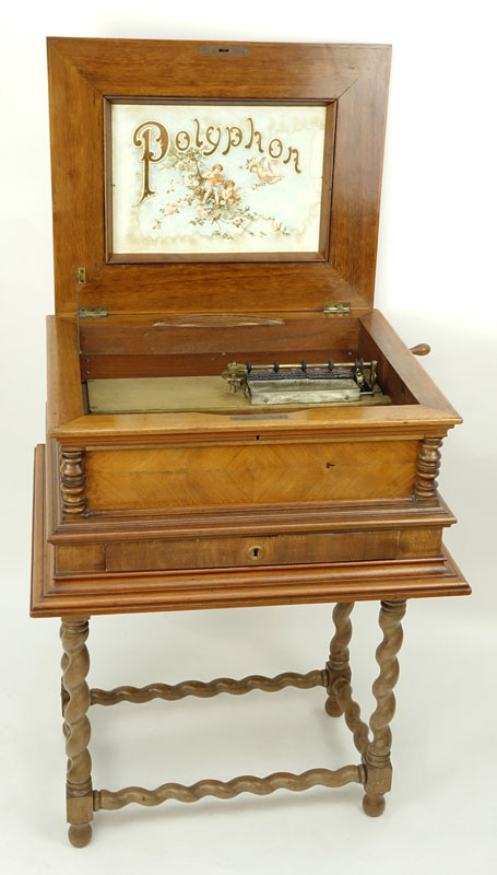 Antique Polyphon Brevete SGDG Music Box with 38 Discs atop a Associated Base. Walnut case with floral inlay top.