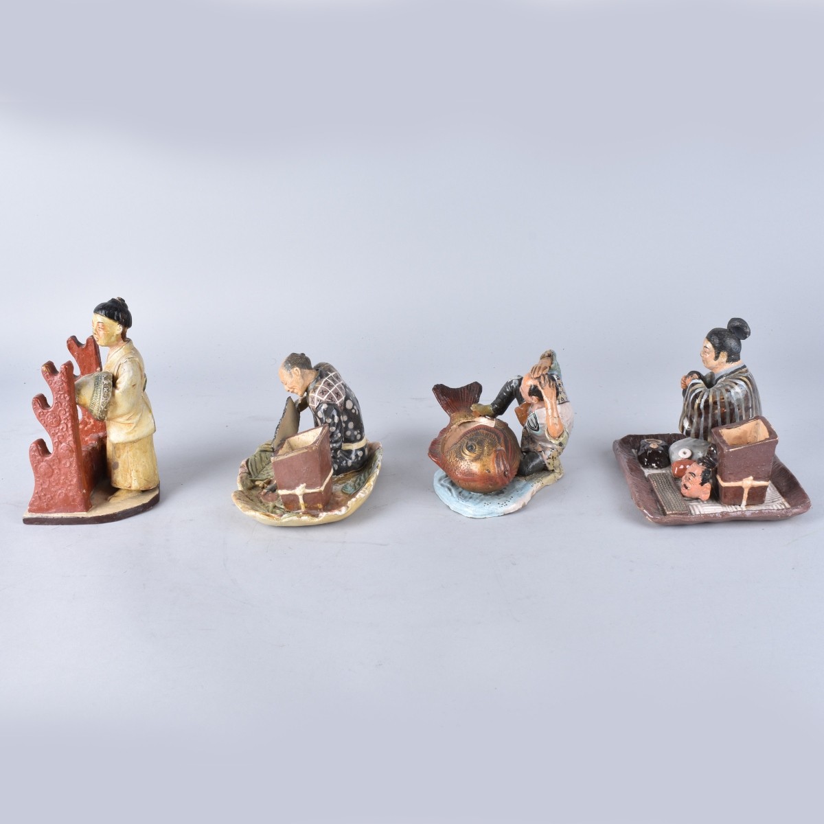 Four Japanese Pottery Figures