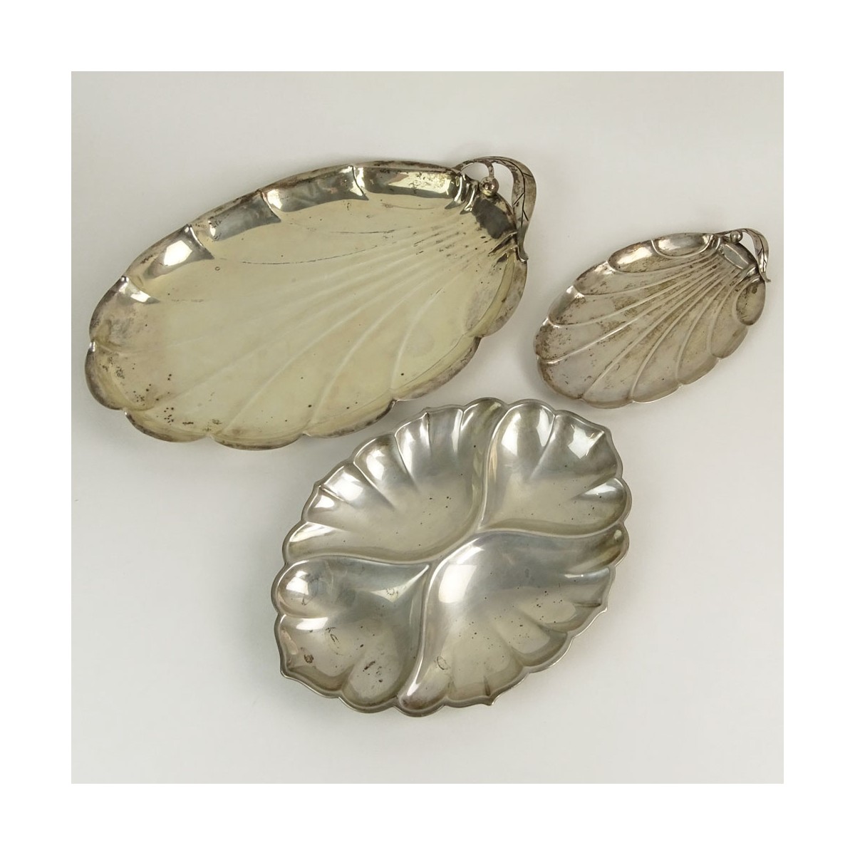 Collection of Three (4) Sterling Silver Leaf Shaped Serving Trays. Signed Sterling. Largest measure