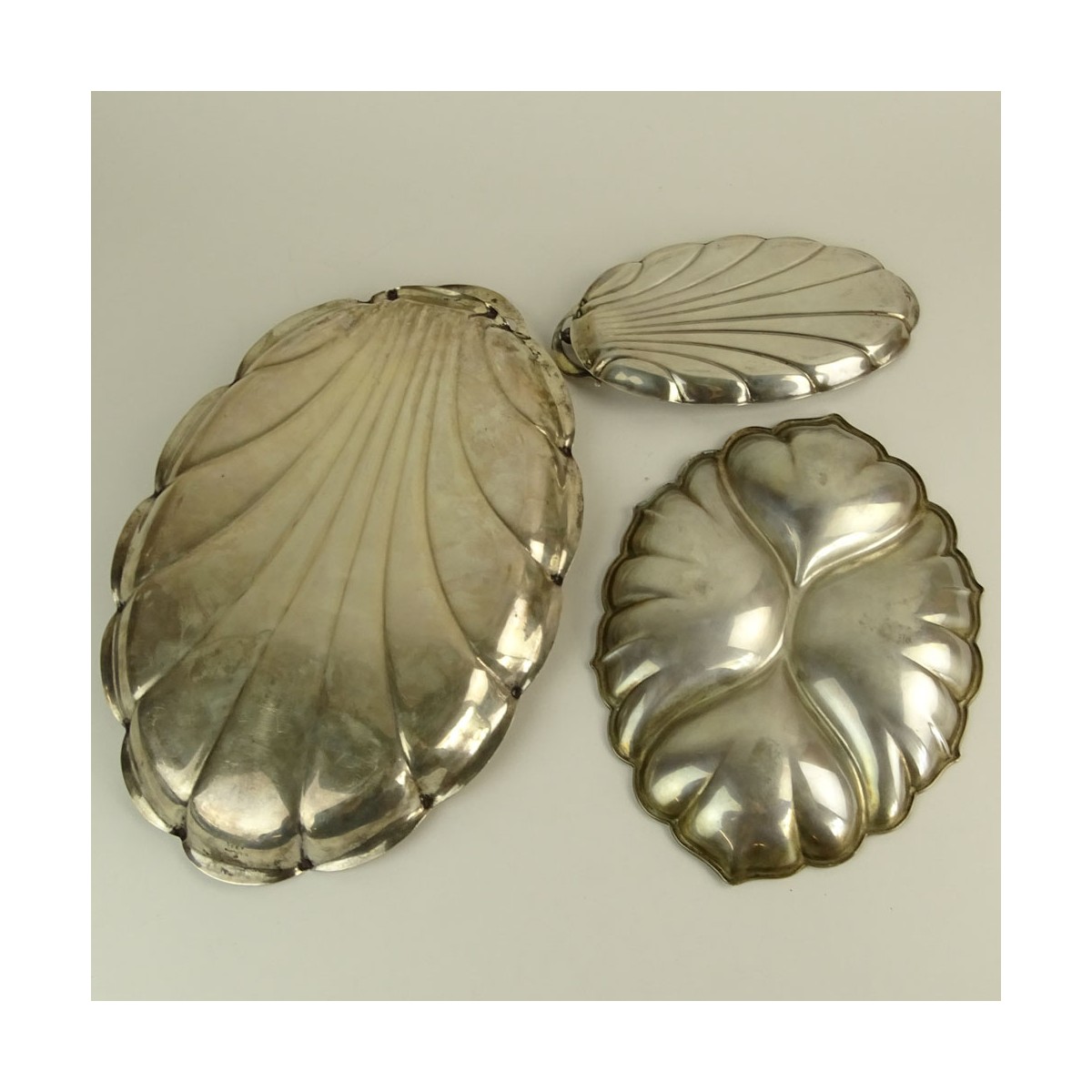 Collection of Three (4) Sterling Silver Leaf Shaped Serving Trays. Signed Sterling. Largest measure