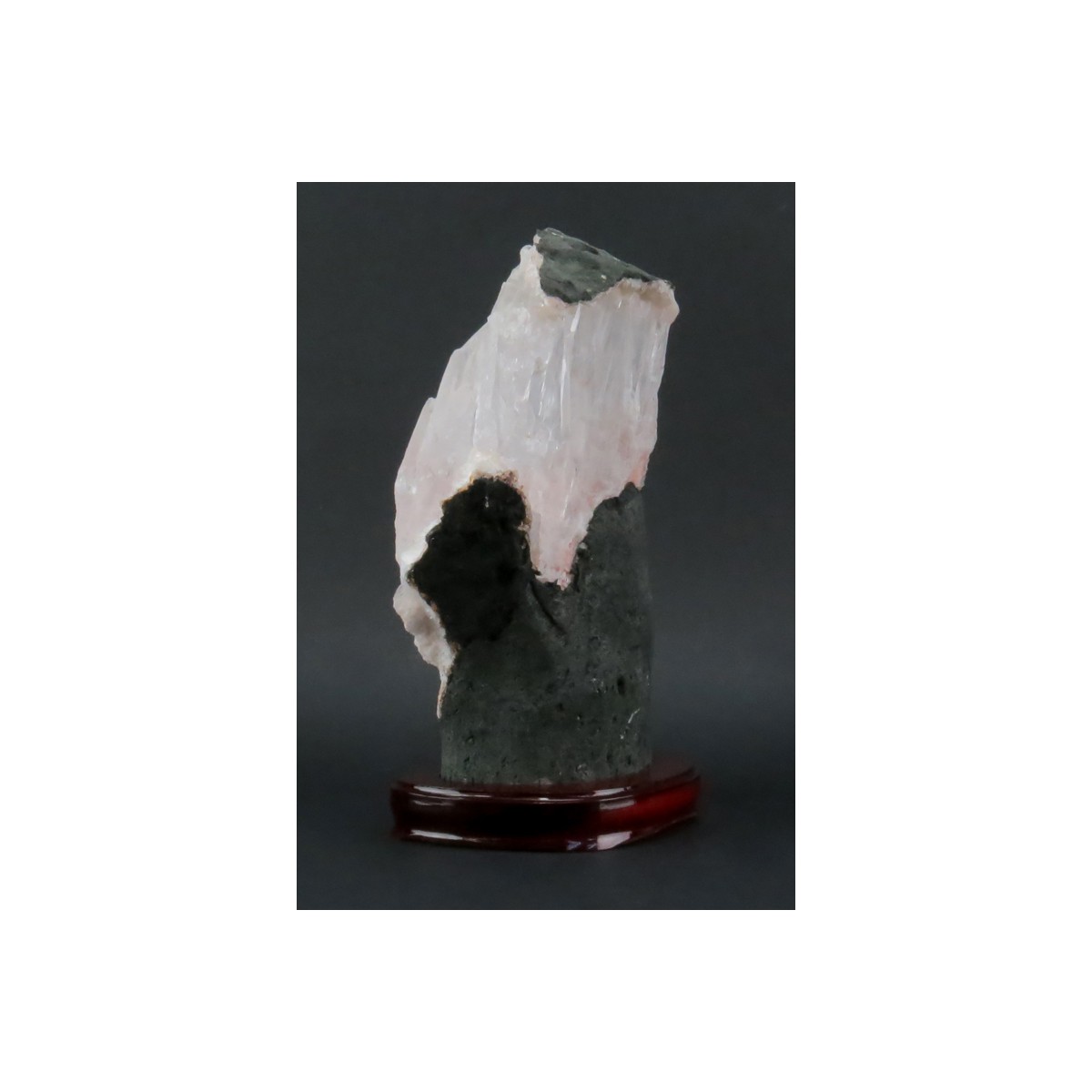 Rock Quartz Lapidary Specimen on Wooden Stand. Clear to rose color shades and various structures. N