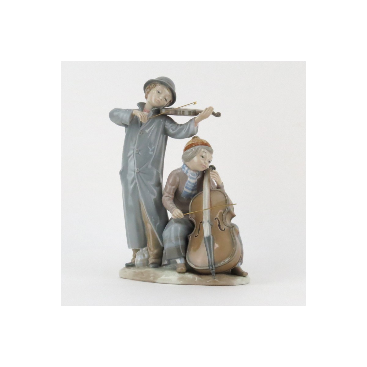 Zaphir Lladro Style Young Musicians Porcelain Grouping. Signed and artist signed Jose Puche, marked