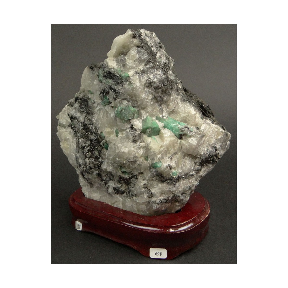 Mineral Specimen with Emeralds Mounted on Wooden Base. Measures 6-7/8 Inches by 6-1/2 Inches. Measu