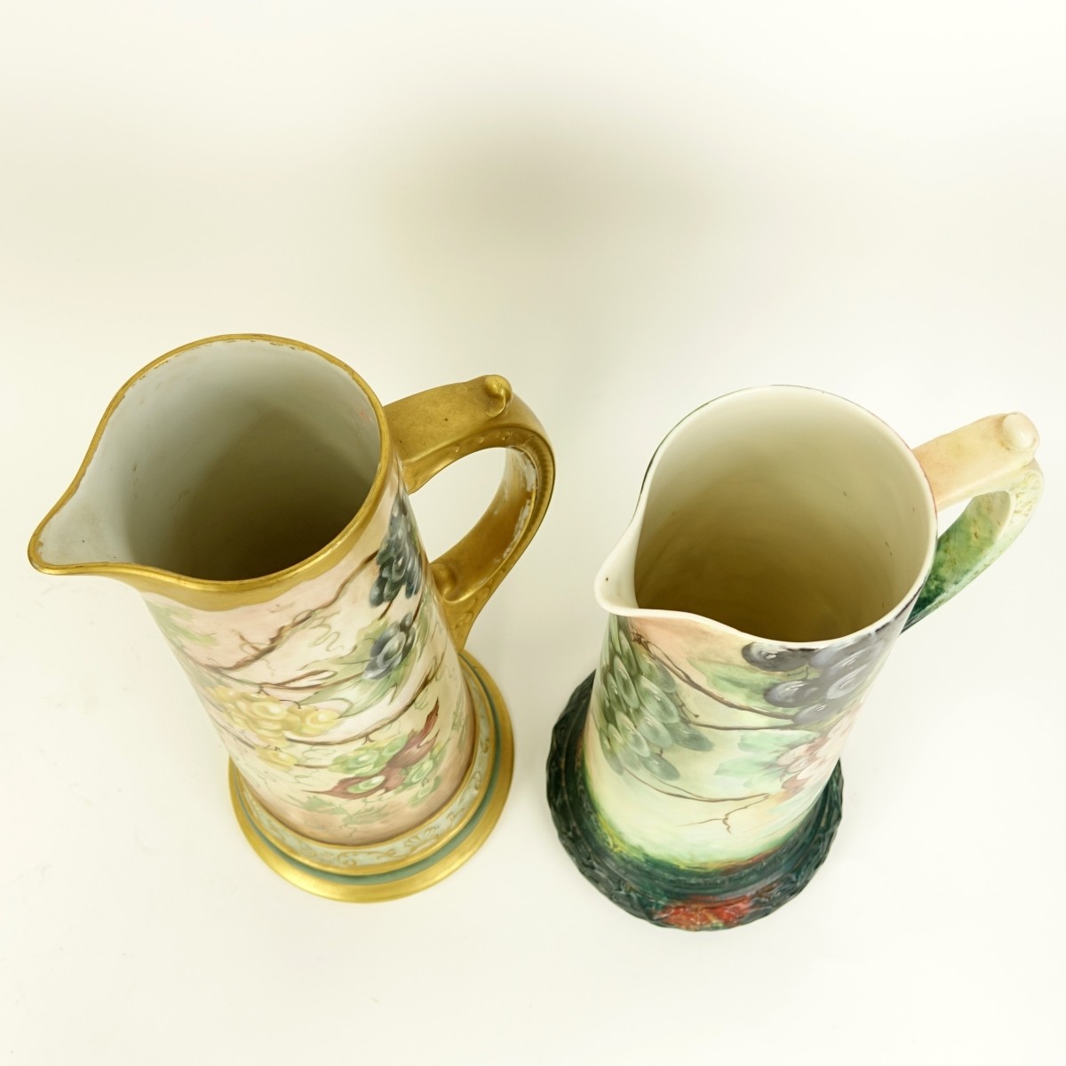 Two Antique Signed Pitchers