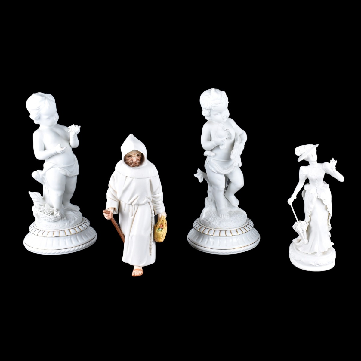 Four Bisque Figurines