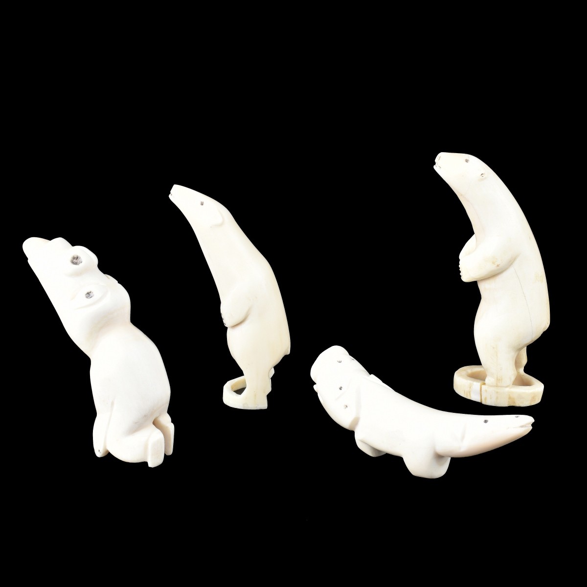 Four Inuit Carved Walrus Ivory Figurines