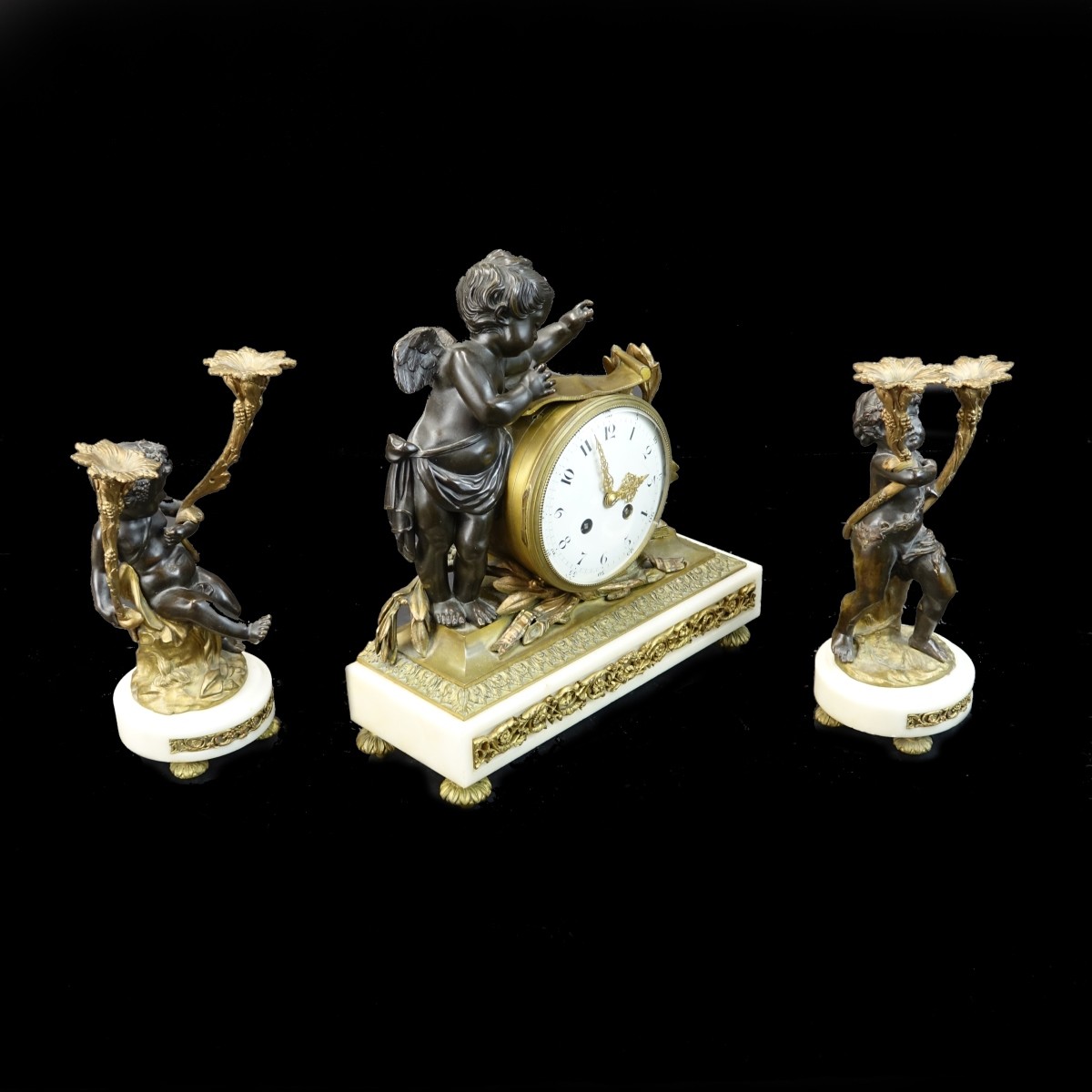 Three Piece Cupid Ormolu Clock Set