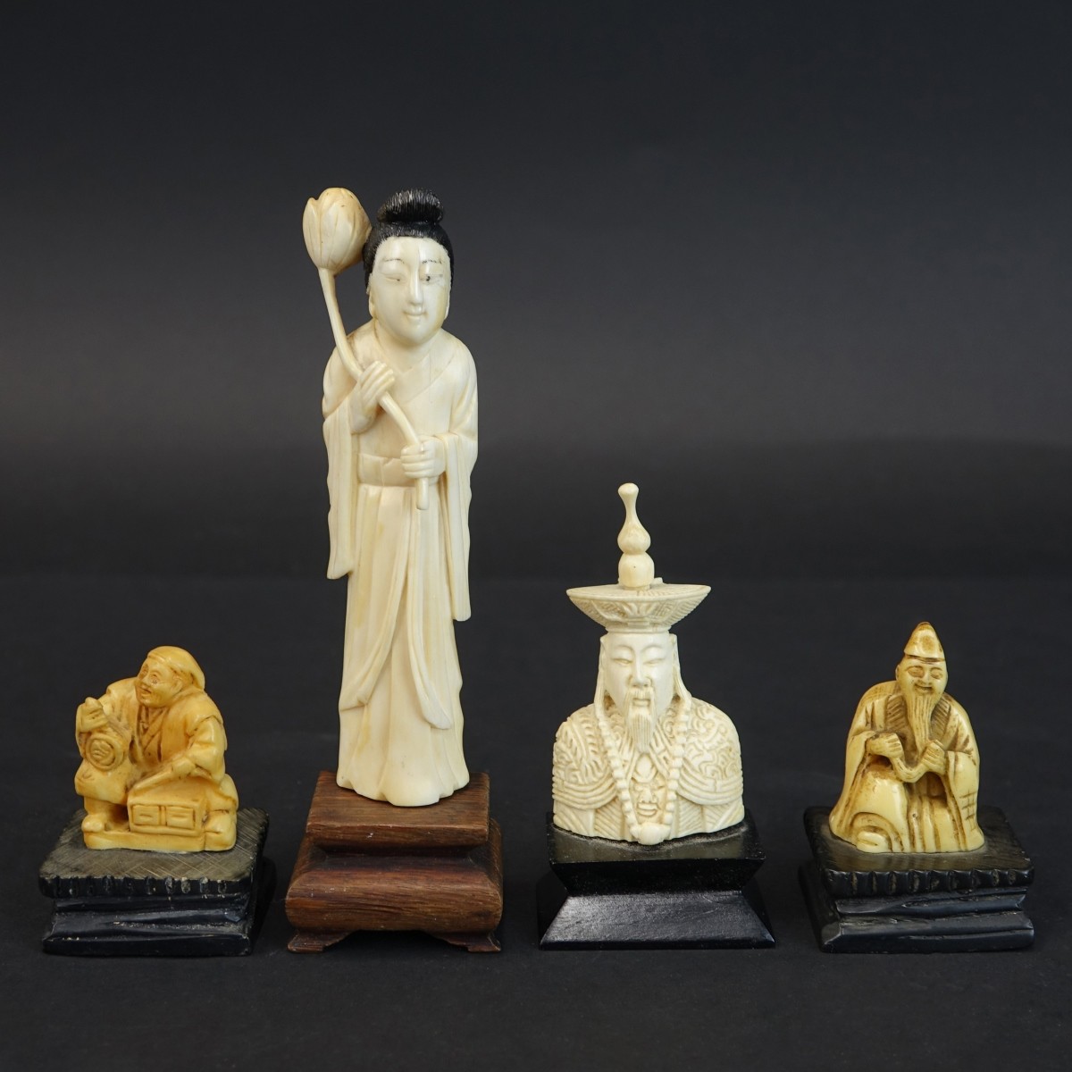 Four (4) Oriental Carved Figurines