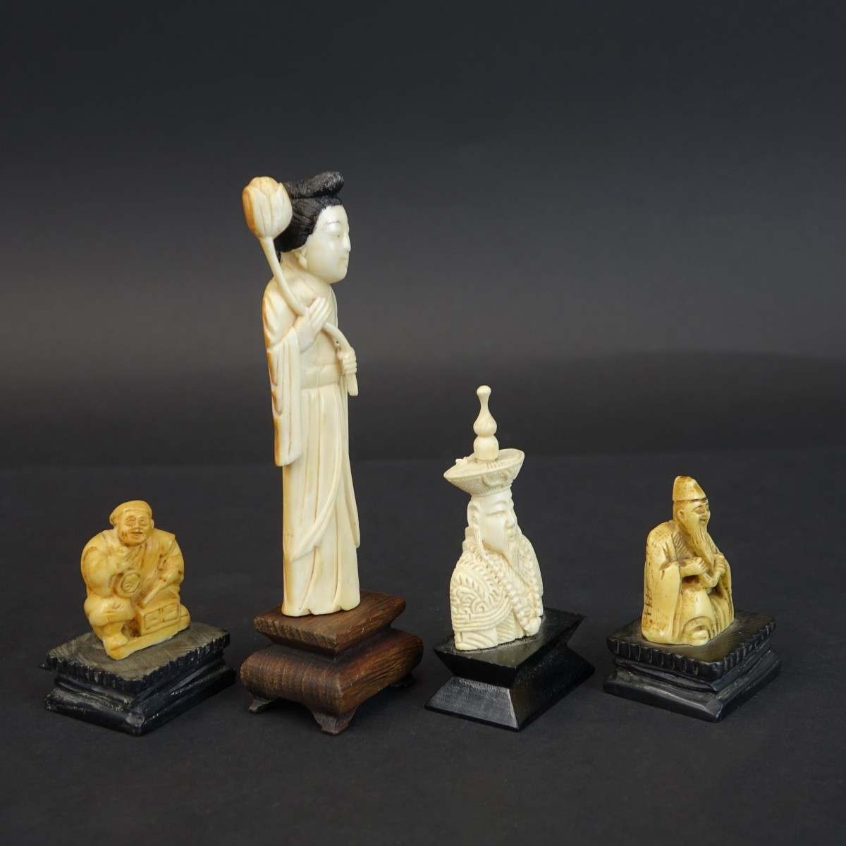 Four (4) Oriental Carved Figurines