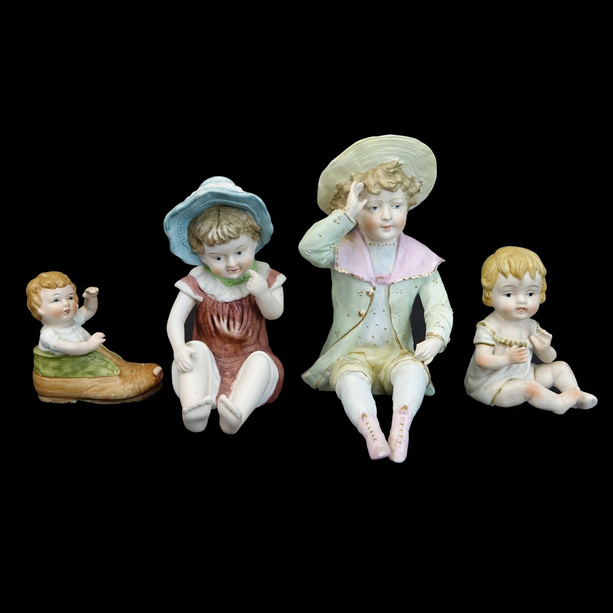 Four (4) Vintage Bisque Figurines