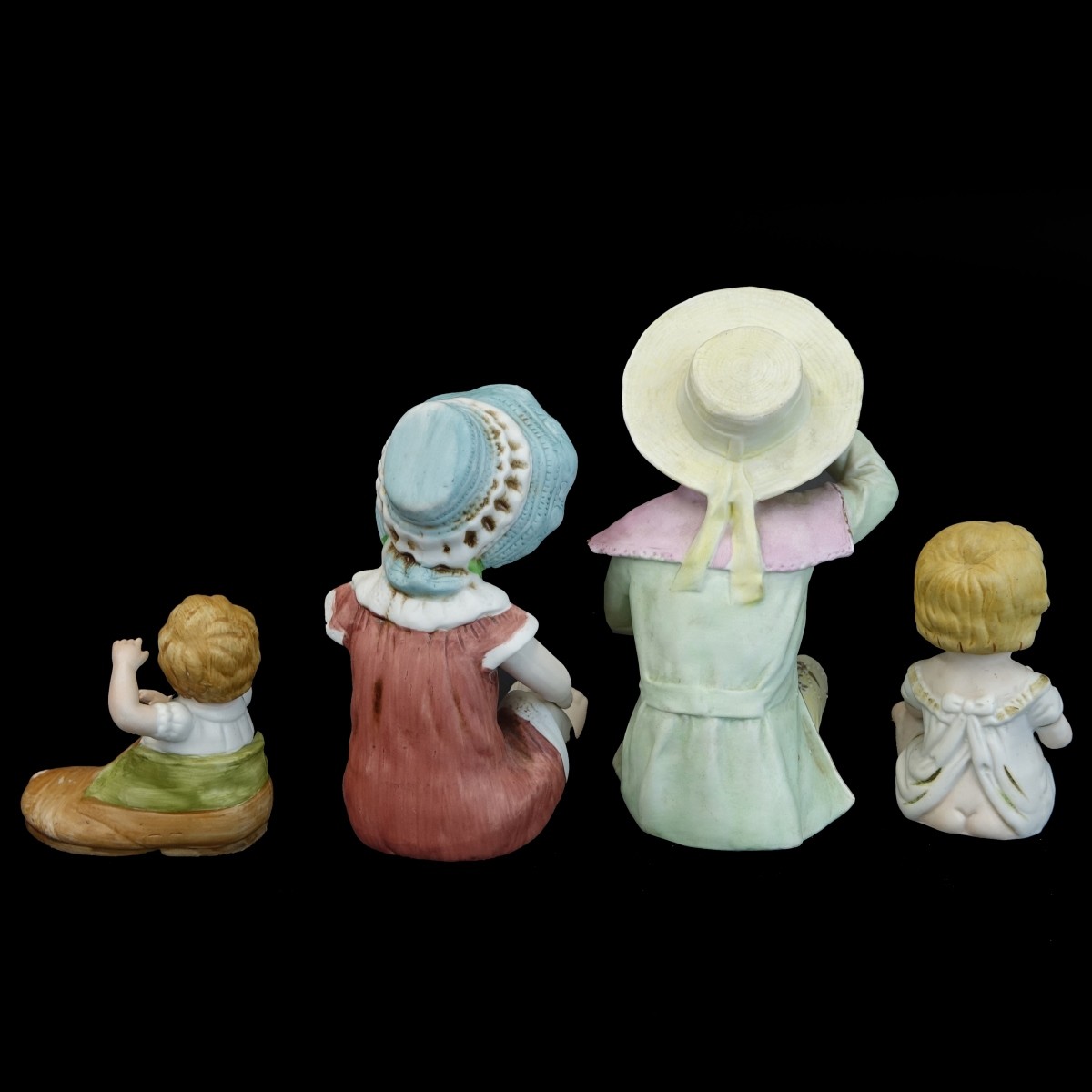 Four (4) Vintage Bisque Figurines