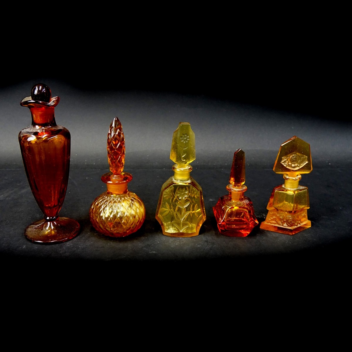 Five (5) Vintage Amber Color Perfume Bottles