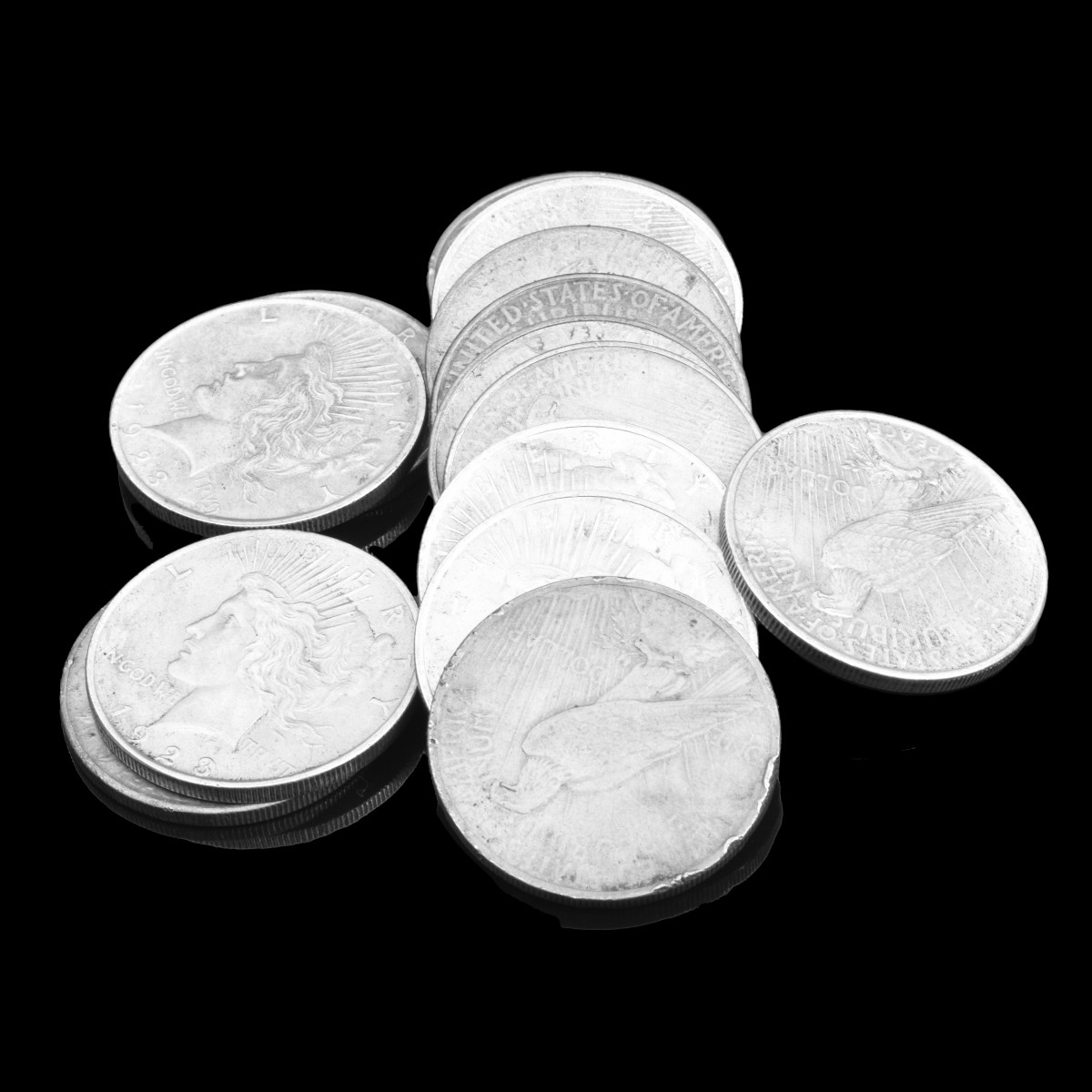 Fourteen U.S. Silver Peace Dollars