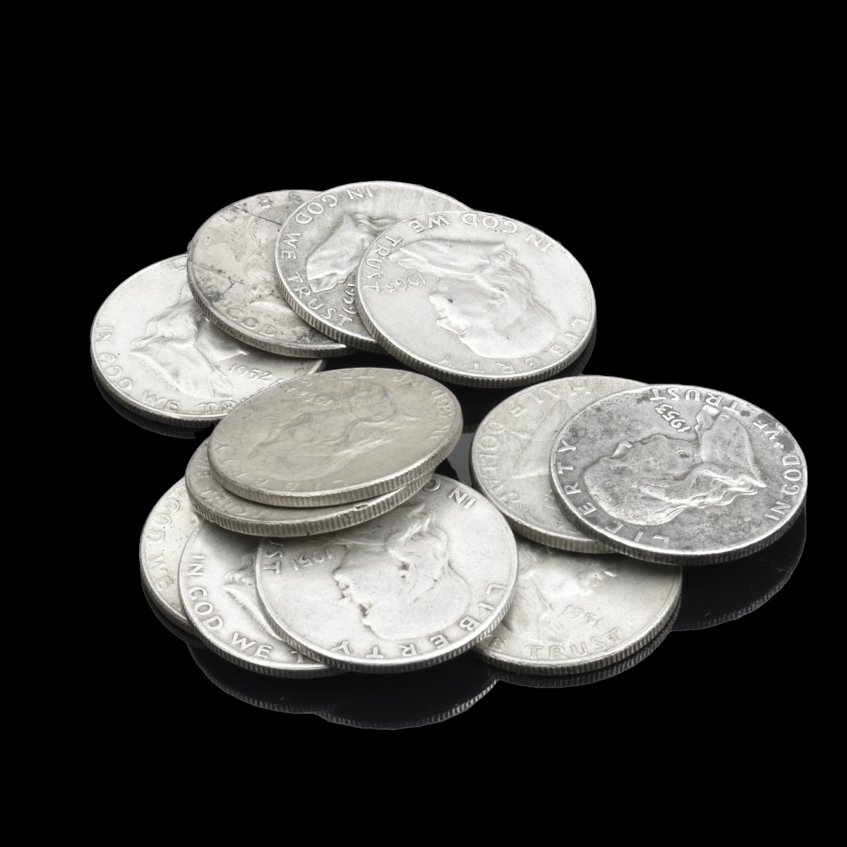 Twelve U.S. Silver Franklin Half Dollars