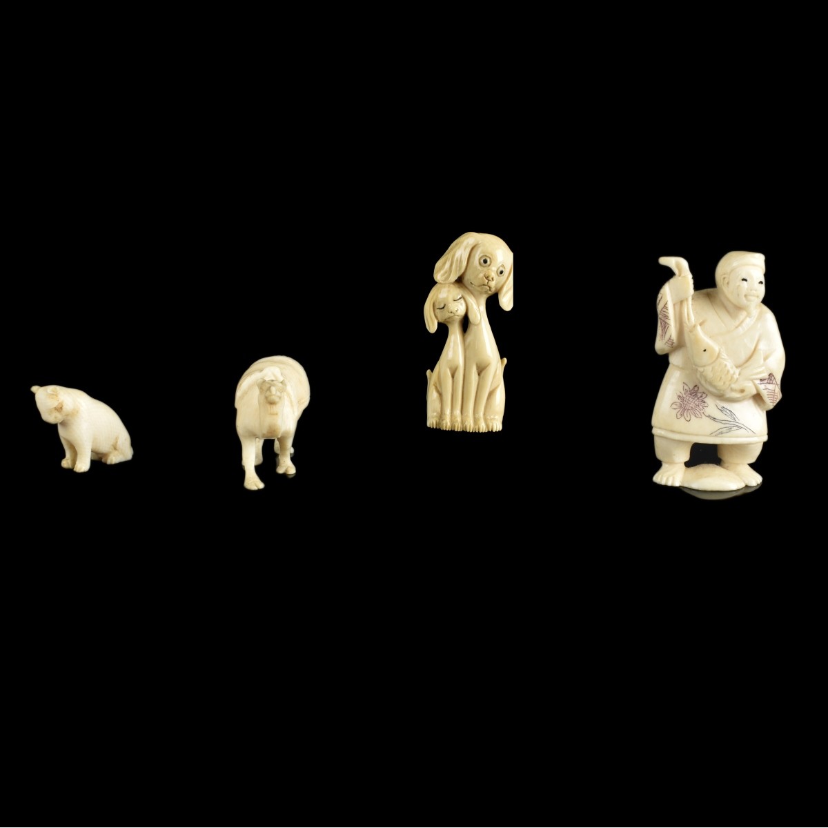 Four Antique Carved Figurines