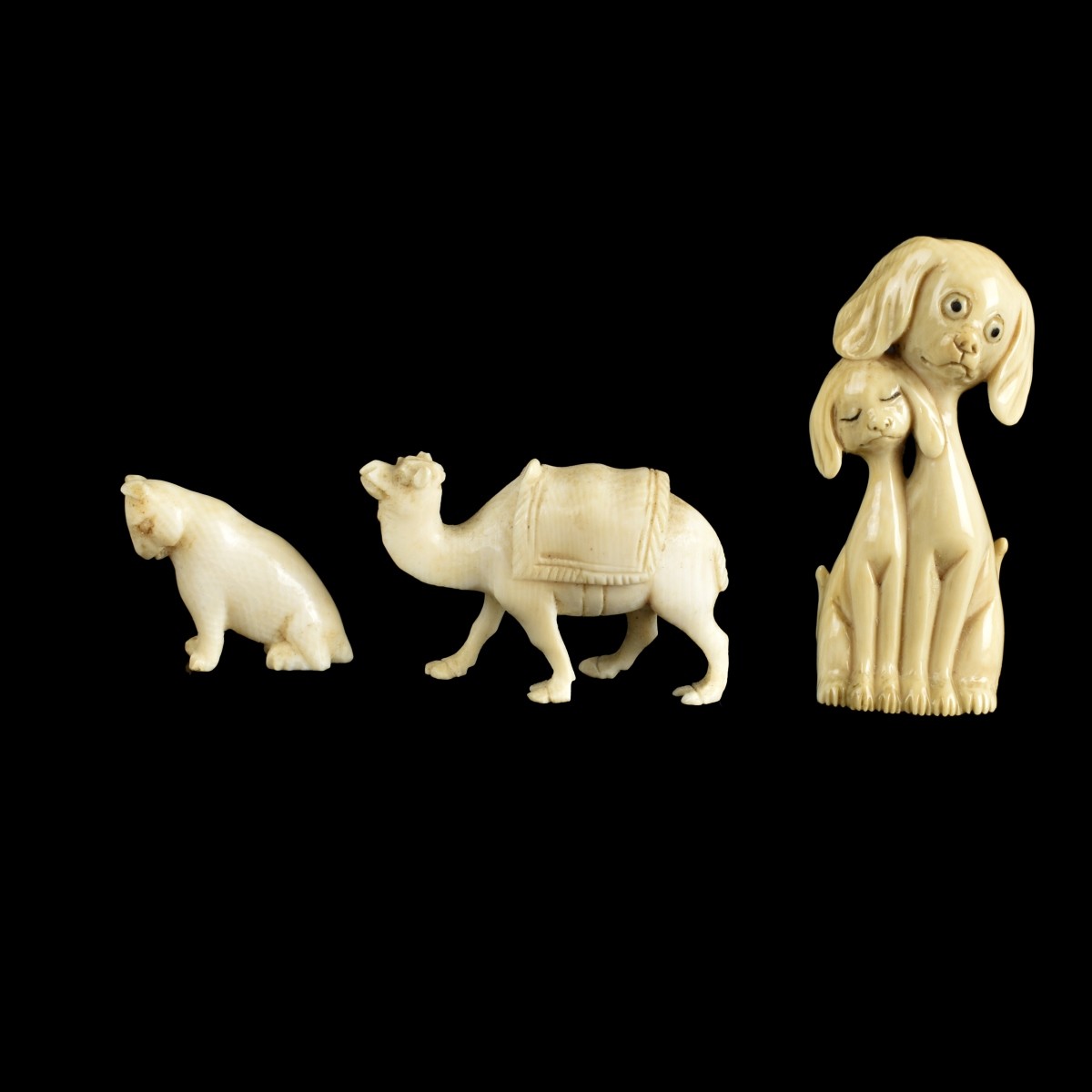 Four Antique Carved Figurines