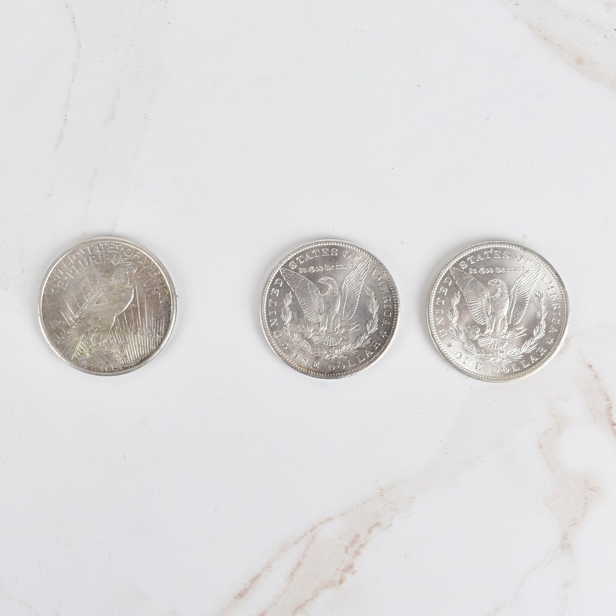 Three US Silver Dollar Coins