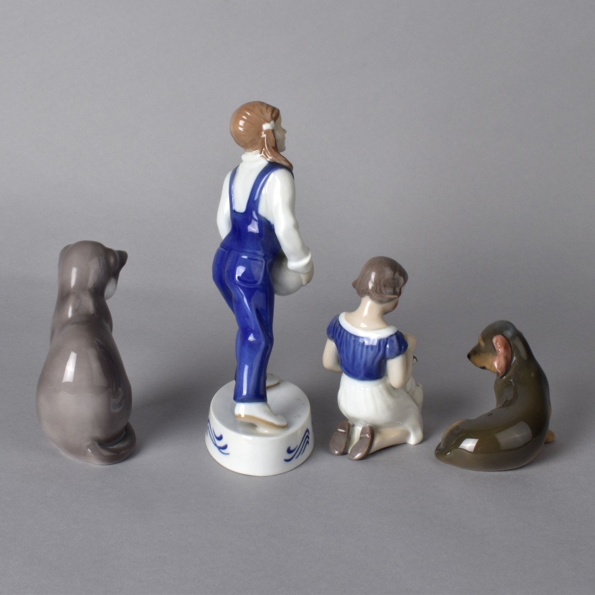 Four Porcelain Figurines