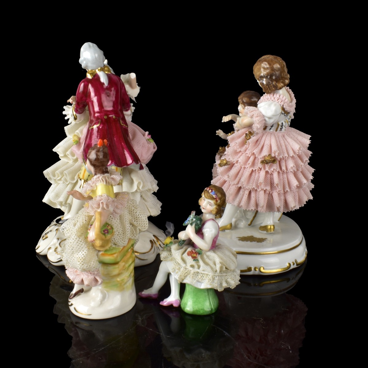 Four Dresden Lace Porcelain Figurines