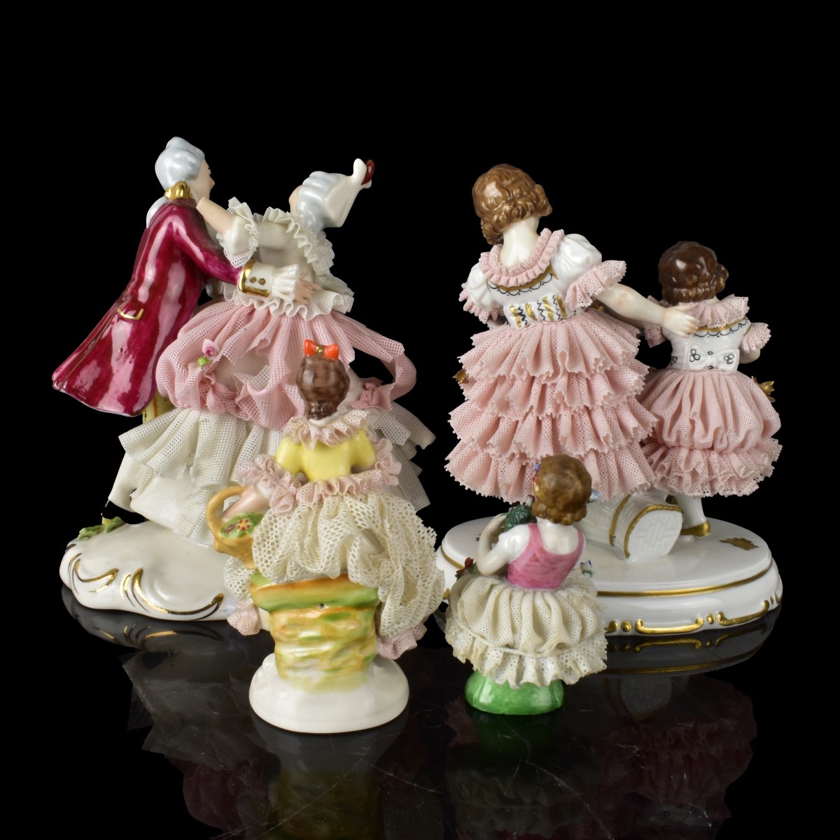 Four Dresden Lace Porcelain Figurines