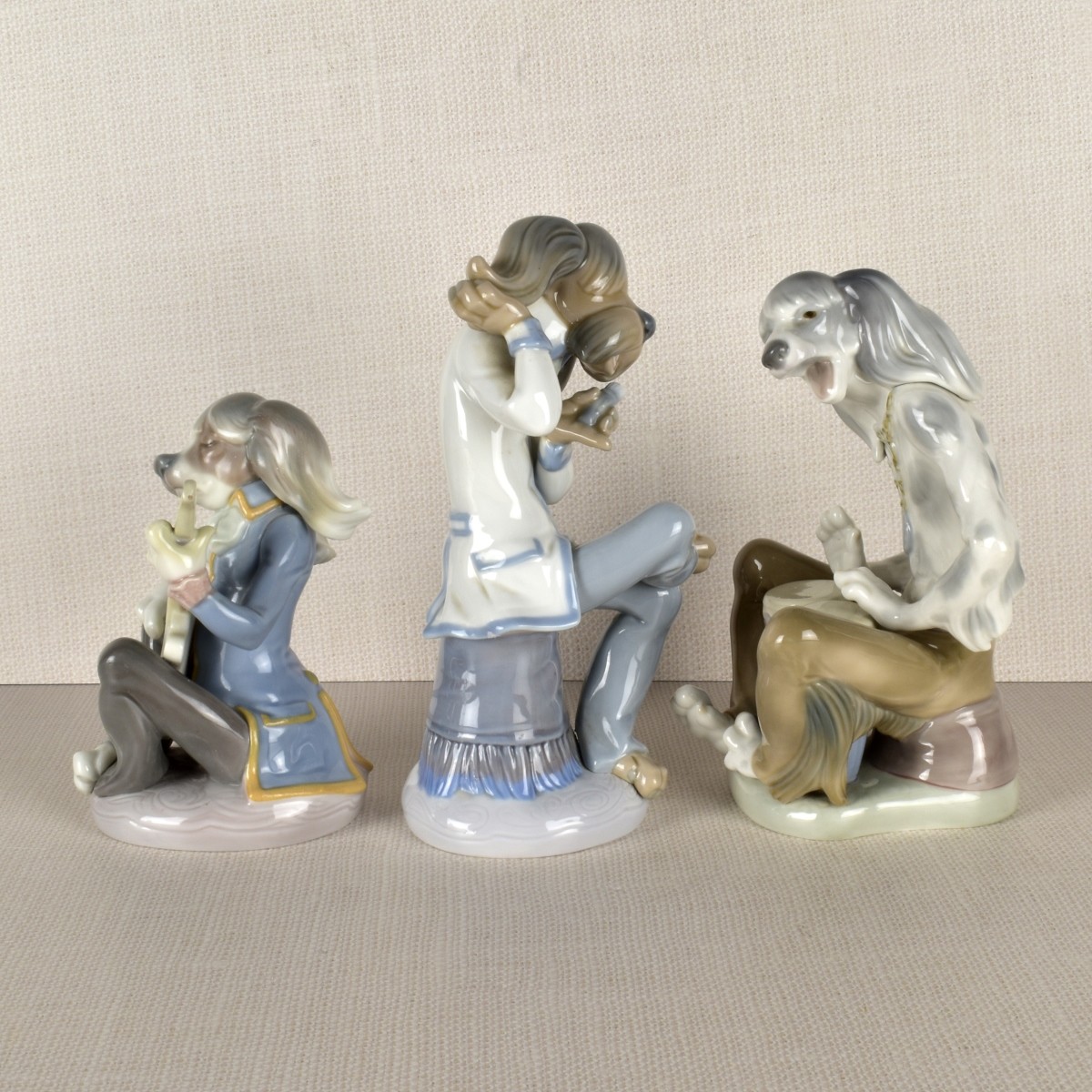 Three Lladro Porcelain Dog Band Figurines