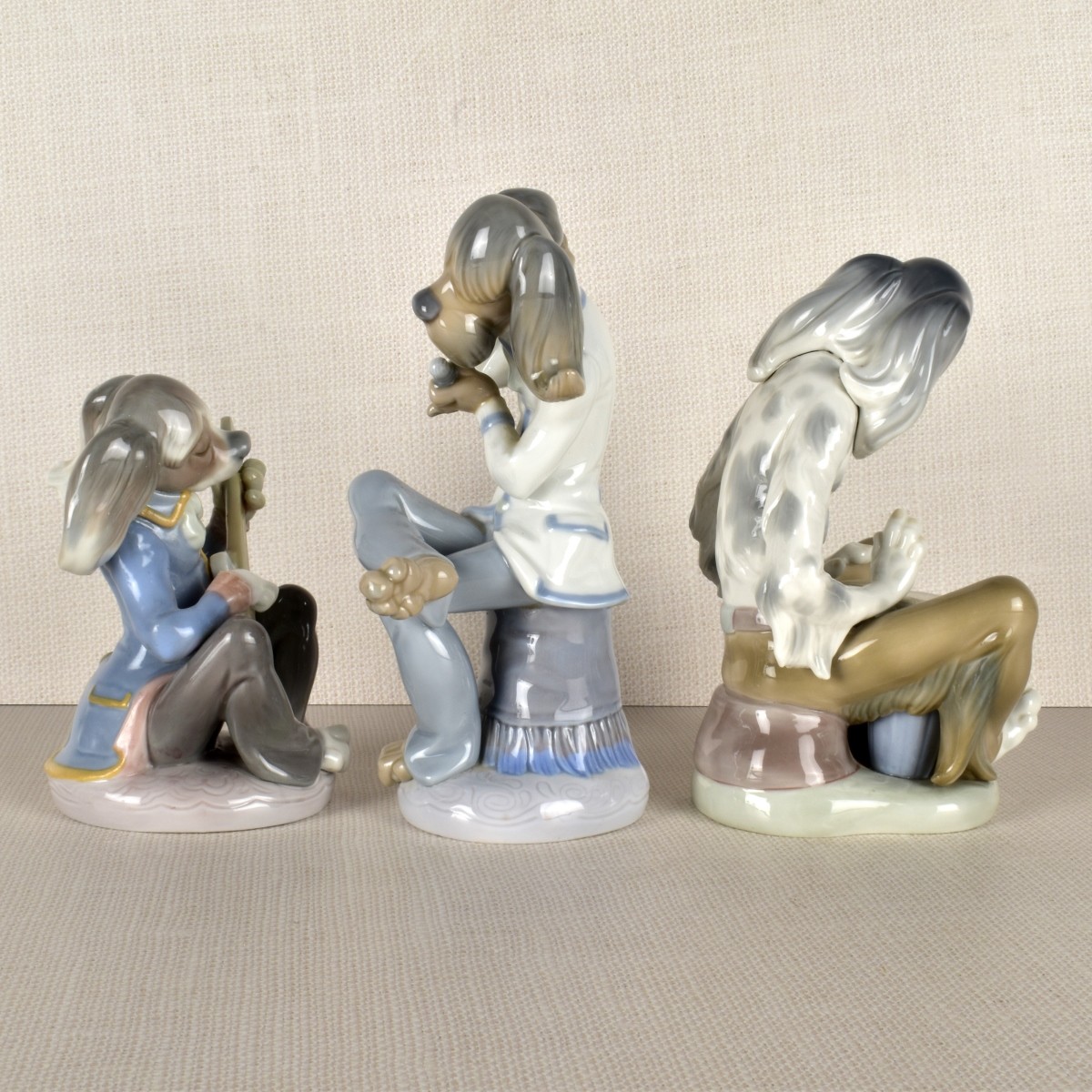Three Lladro Porcelain Dog Band Figurines