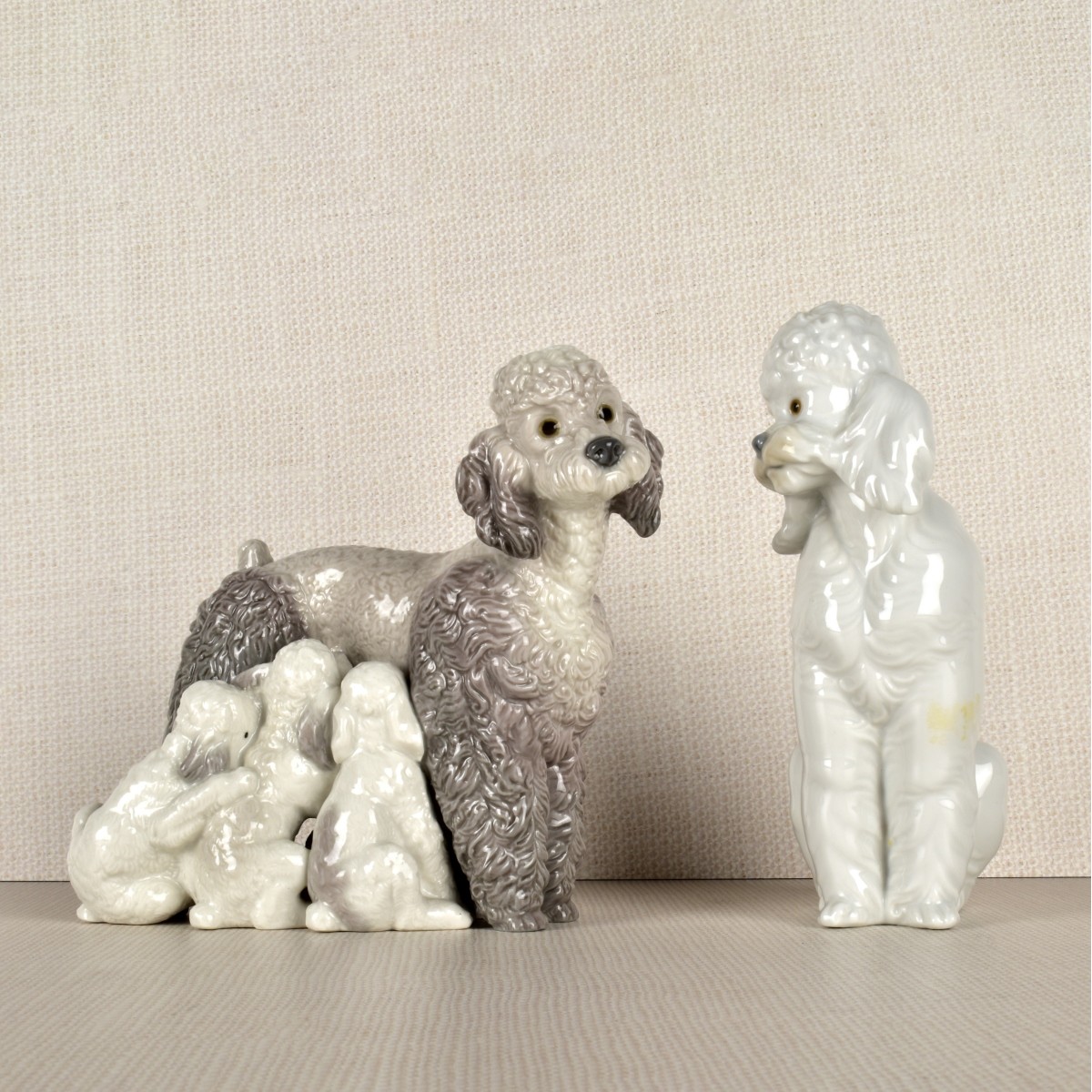 Two Lladro Porcelain Poodle Figurines