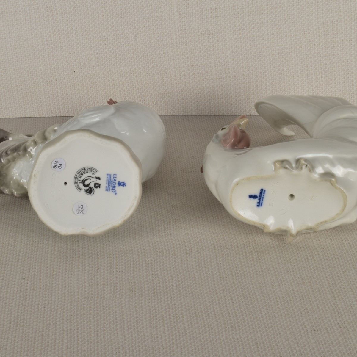 Two Lladro Porcelain Rooster Figurines
