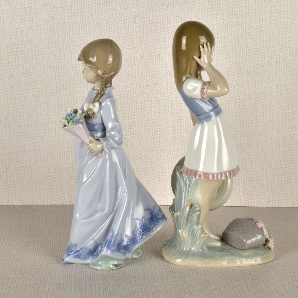 Two Lladro Porcelain Girls with Flowers