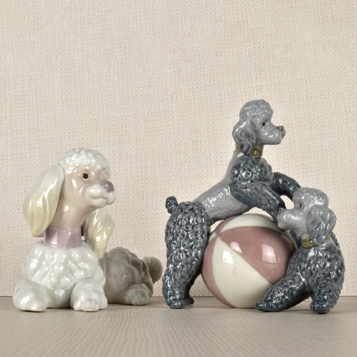 Two Lladro Porcelain Poodle Figurines