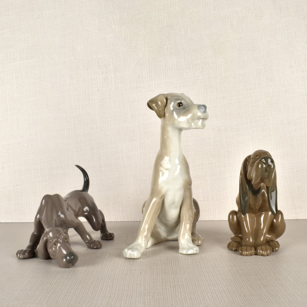 Three Lladro Porcelain Dog Figurines