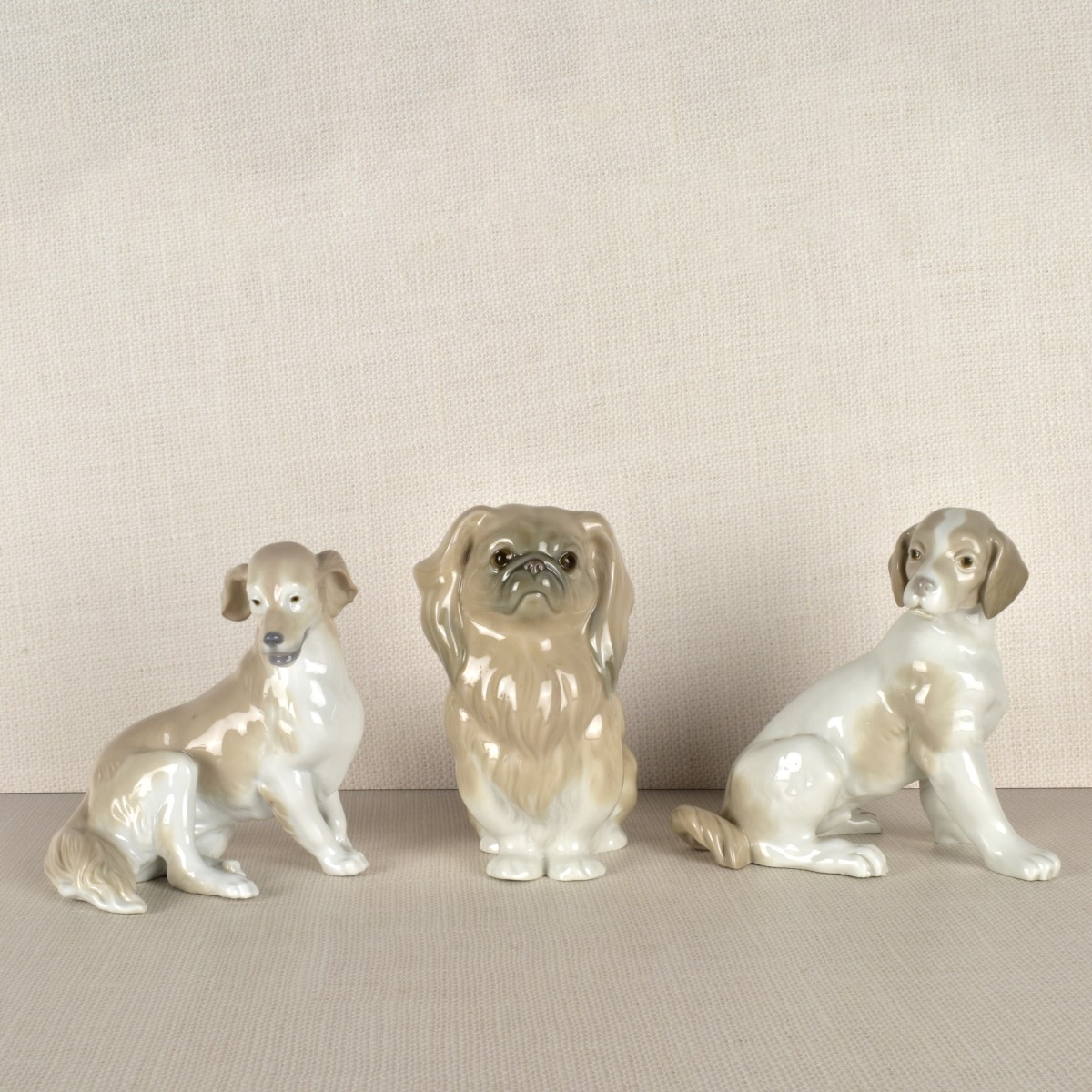 Three Lladro Porcelain Dog Figurines