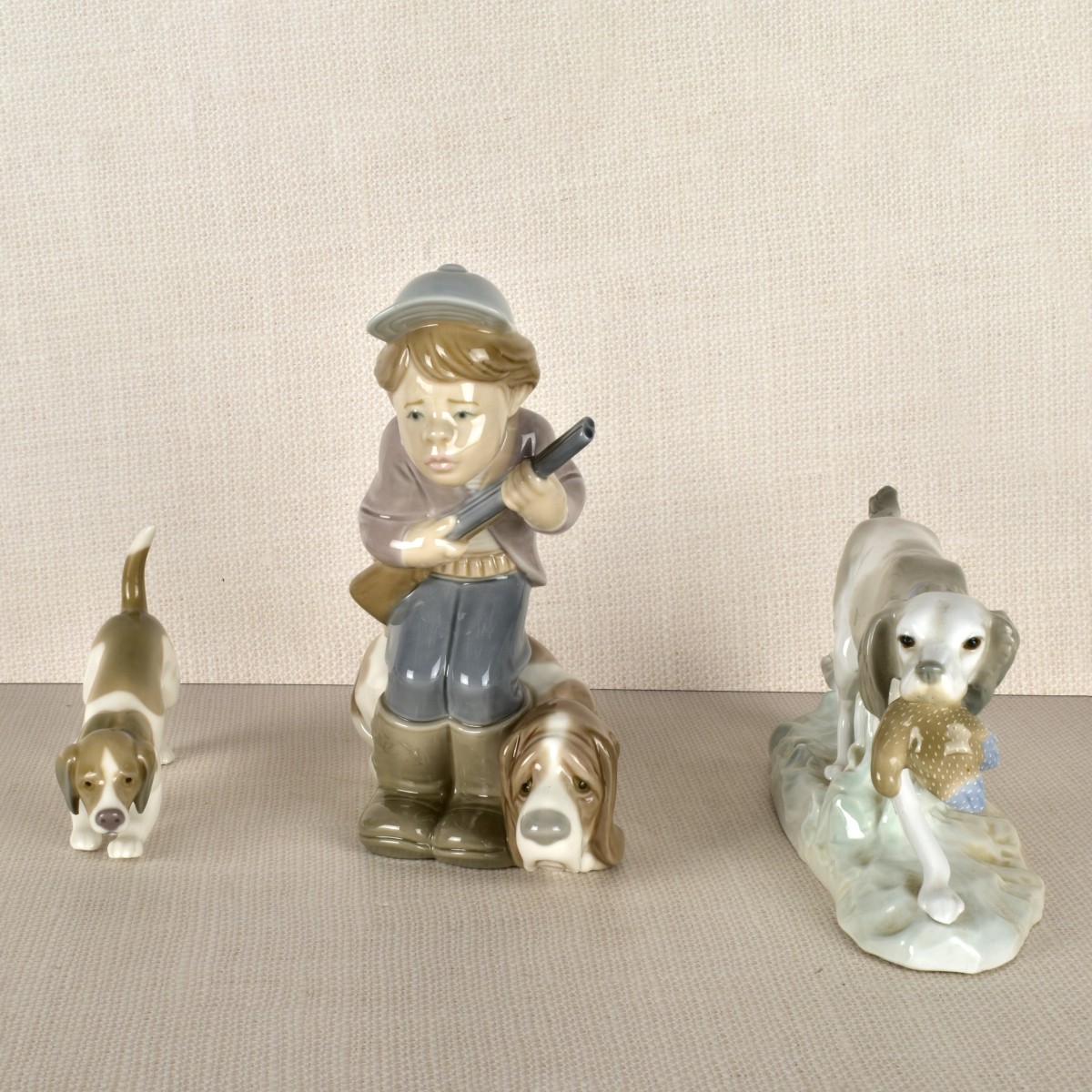 Three lladro Porcelain Hunt Dog Figurines