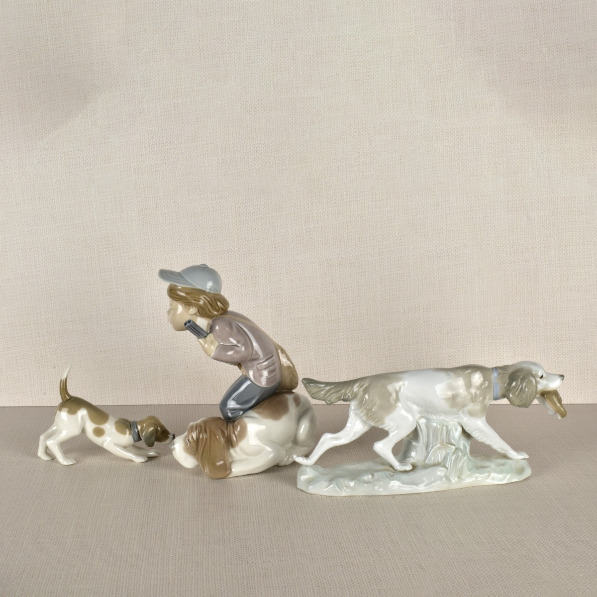 Three lladro Porcelain Hunt Dog Figurines
