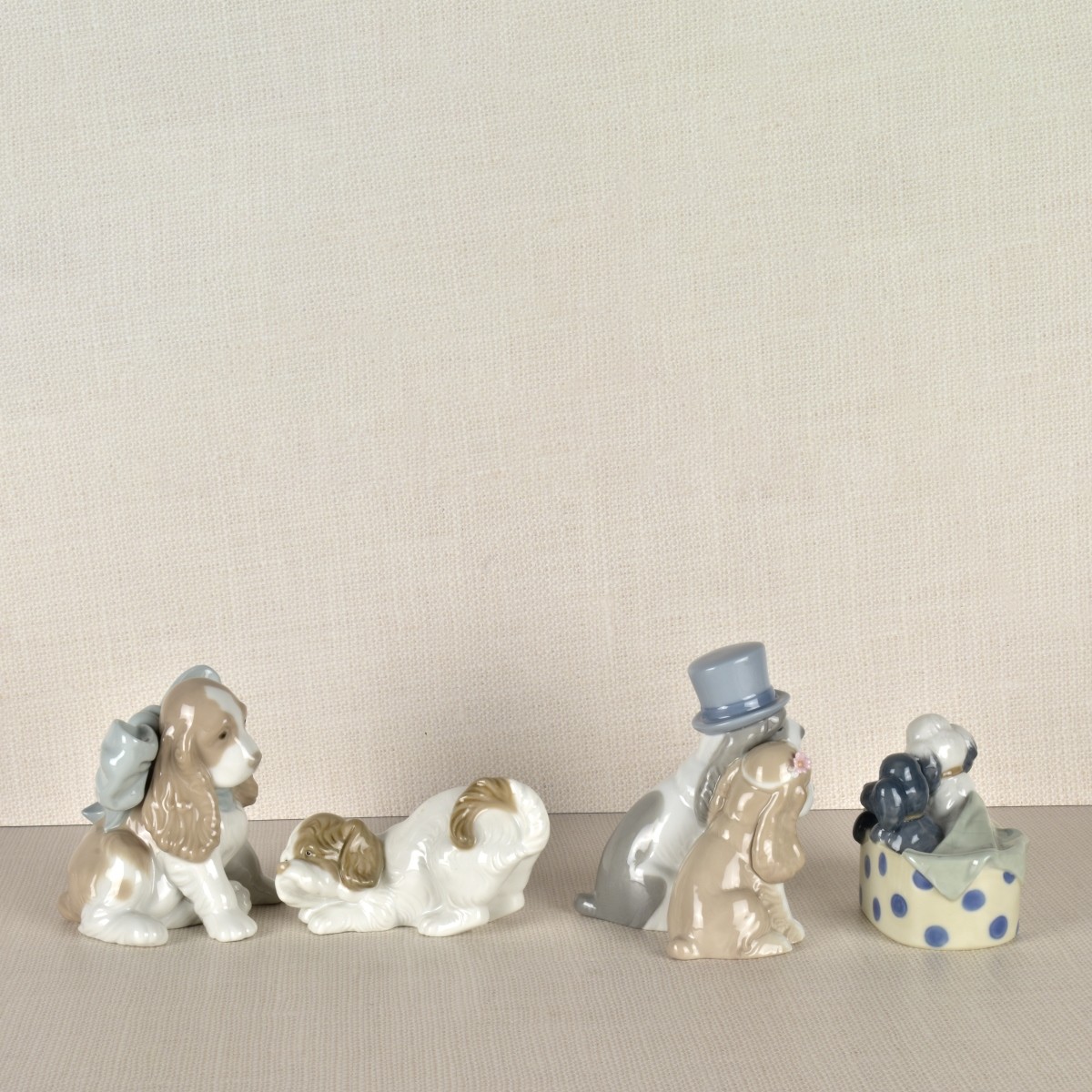 Four Nao Porcelain Dog Figurines