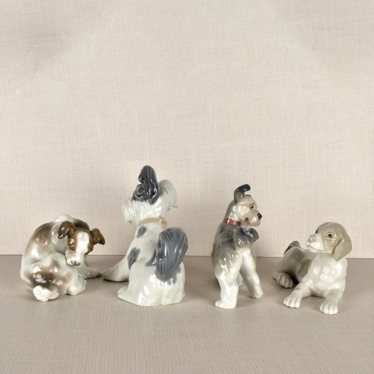 Four Lladro Porcelain Dog Figurines