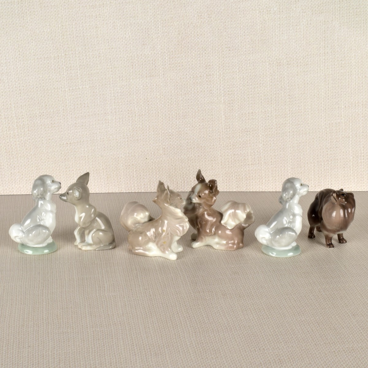 Six Porcelain Dog Figurines mostly Lladro