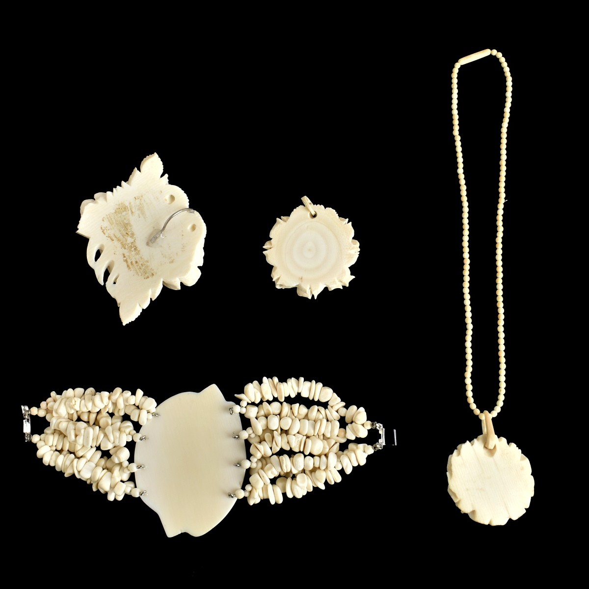 Four Carved Jewelry Items