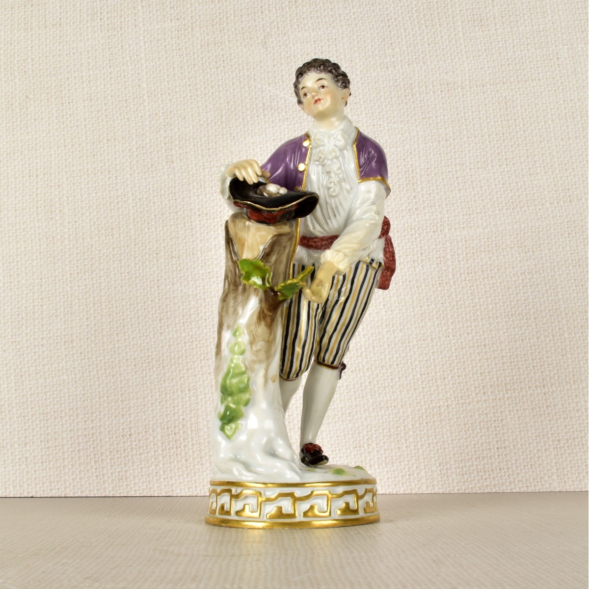 Meissen Figurine of a Boy Gathering Eggs